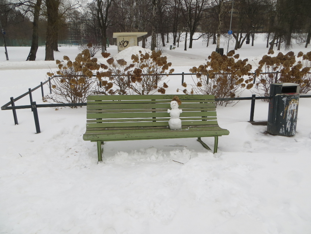 snow man woman person park bench city street photography